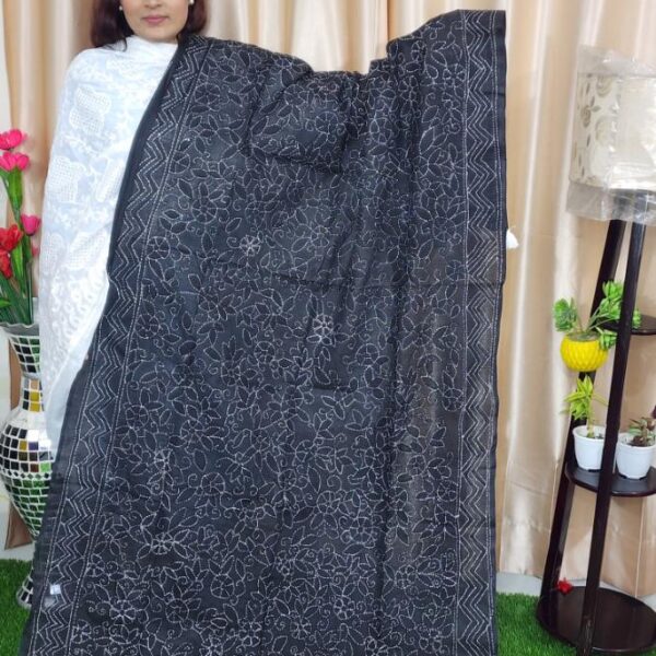 White hand stitching black fabric